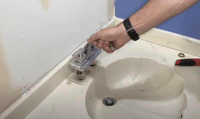 Removing the old faucet for a Bathroom Faucet Replacement